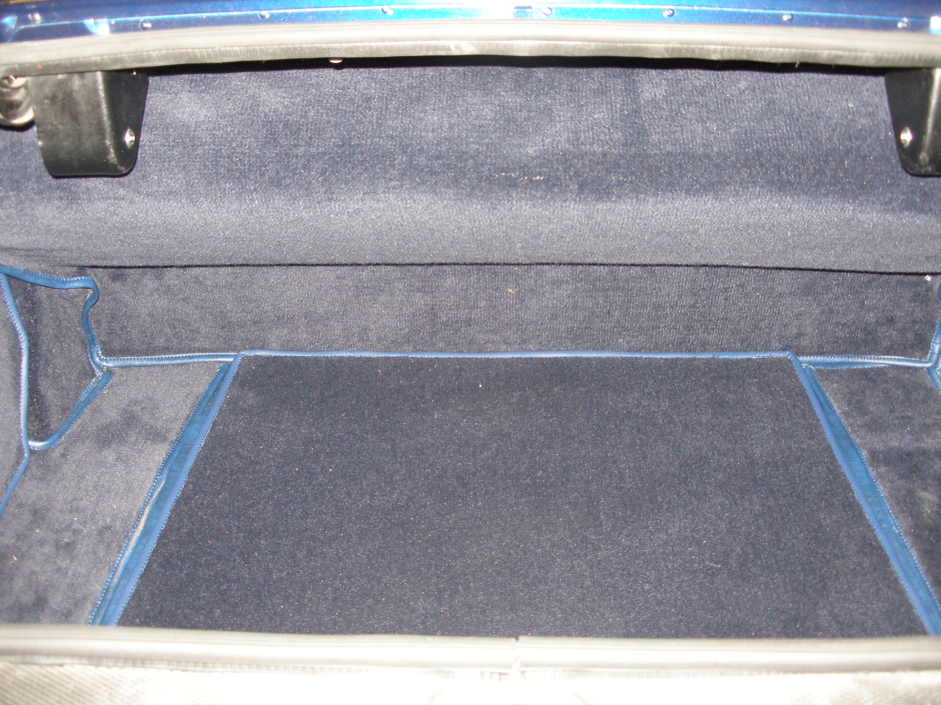 Luxury carpet and boot liner — Aston Martin DBS bespoke interior trim
