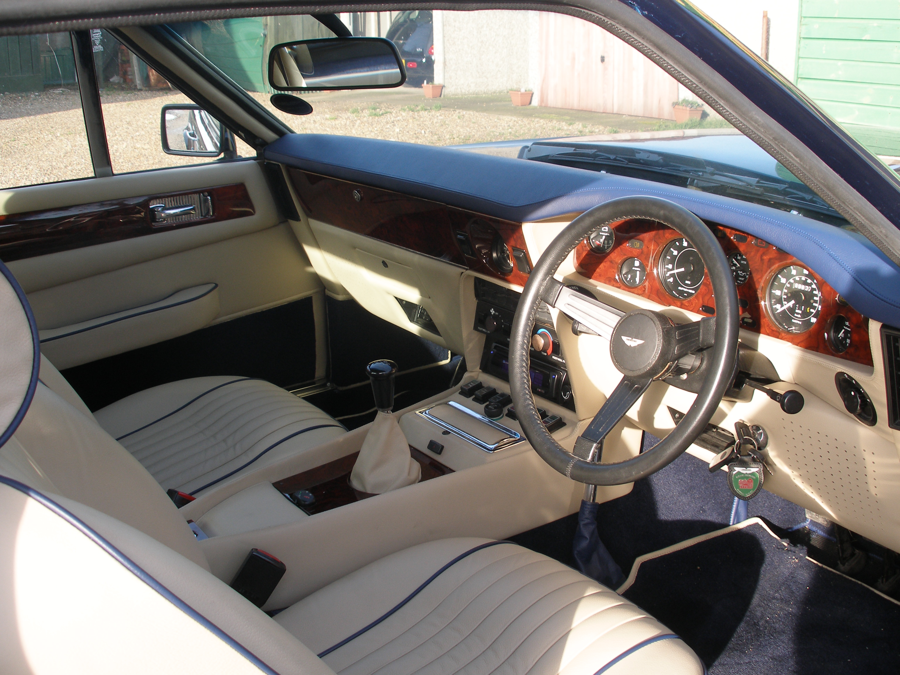 Aston Martin DBS full interior retrim — cream leather with navy piping
