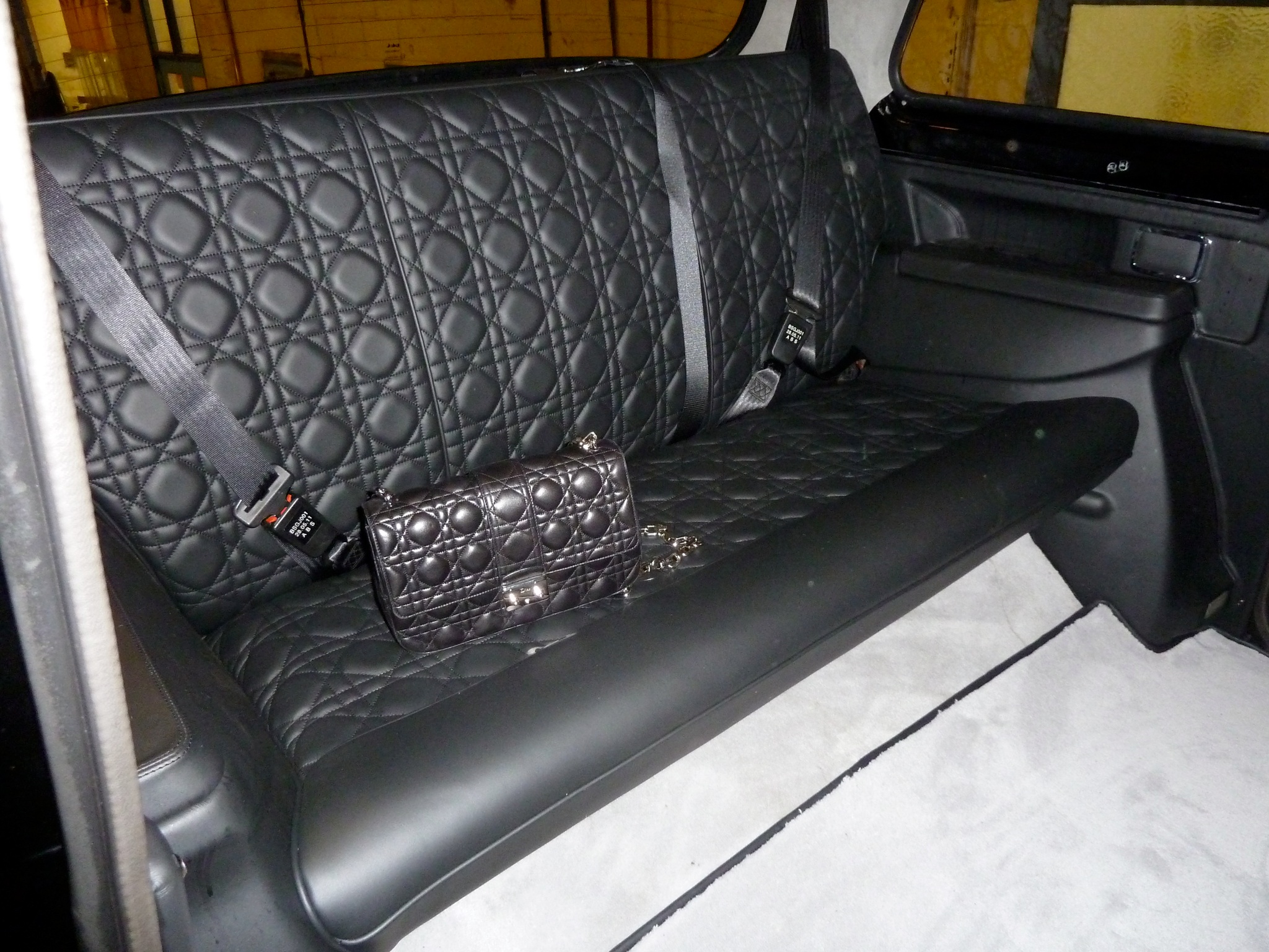 Christian Dior commissioned London black cab — quilted leather interior to match Dior handbag