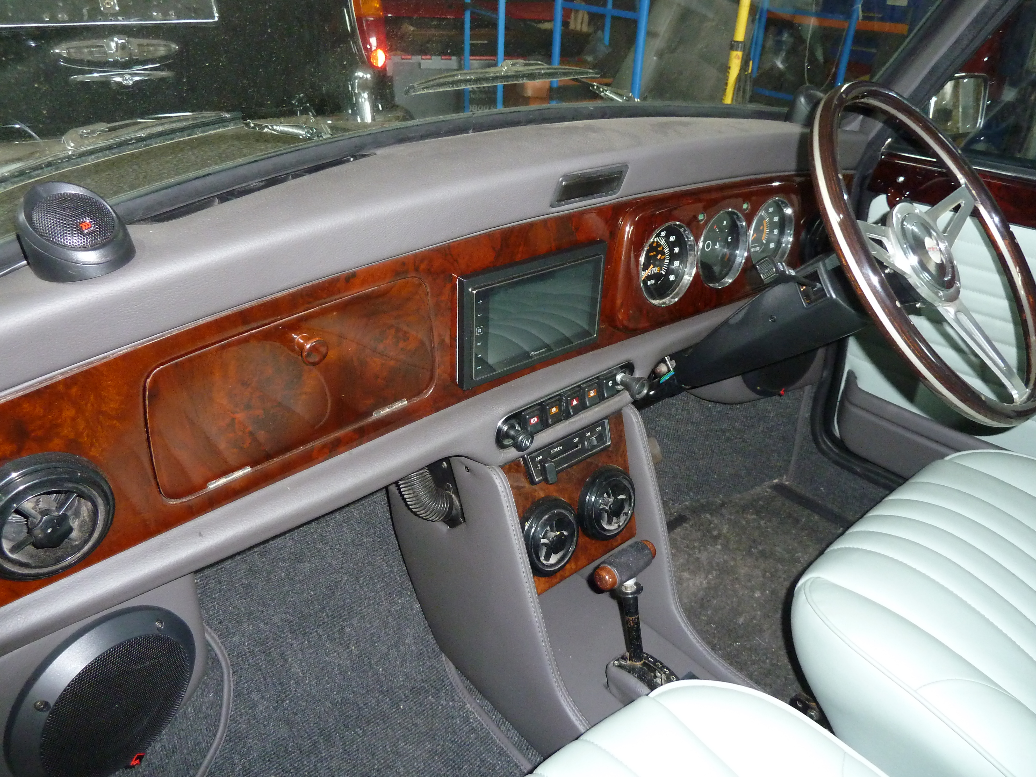 Classic Mini bespoke interior — Rolls Royce inspired walnut dash and grey leather seats