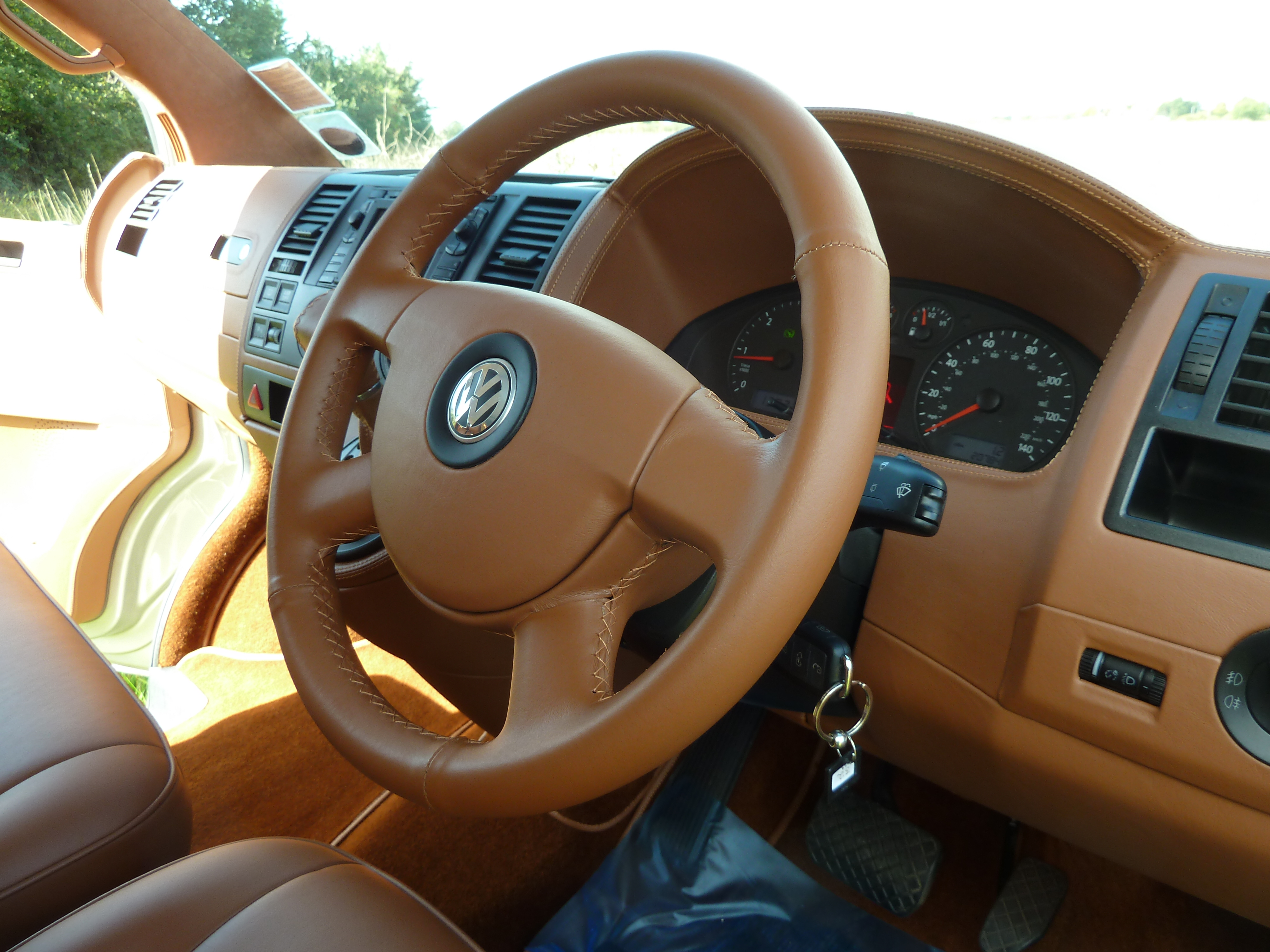 Leather-wrapped dashboard and steering wheel retrim — Auto Interiors of London